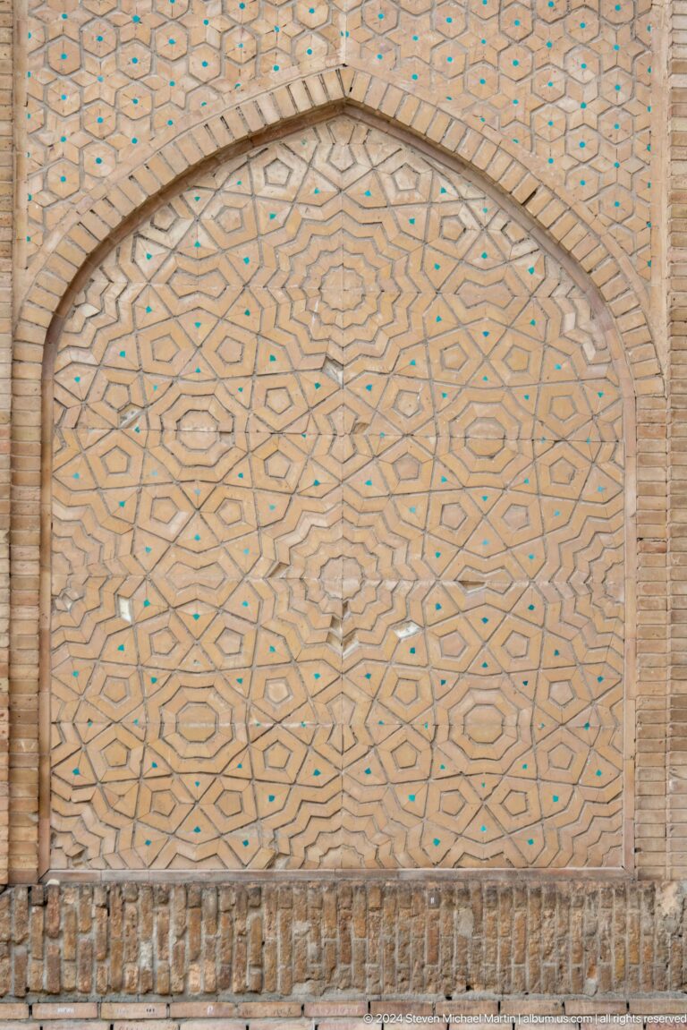 Close-up of geometric brick paving pattern.