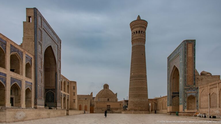 Kalyan Minaret and mosque portal across plaza.