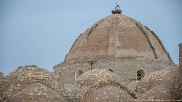 Weathered brick dome with small openings.