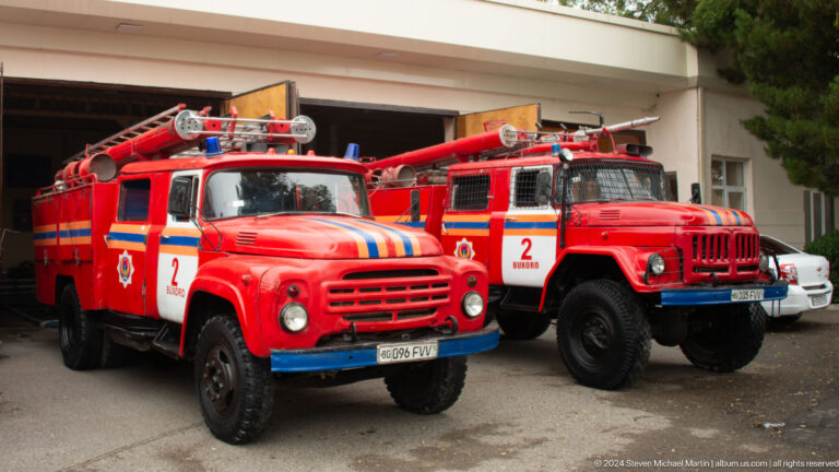 Two red vintage fire engines.
