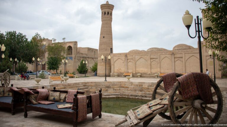 Kalyan Minaret beyond plaza furniture.