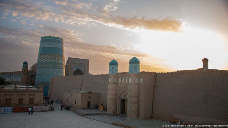 Sunset skyline of kalta minor and domed buildings.