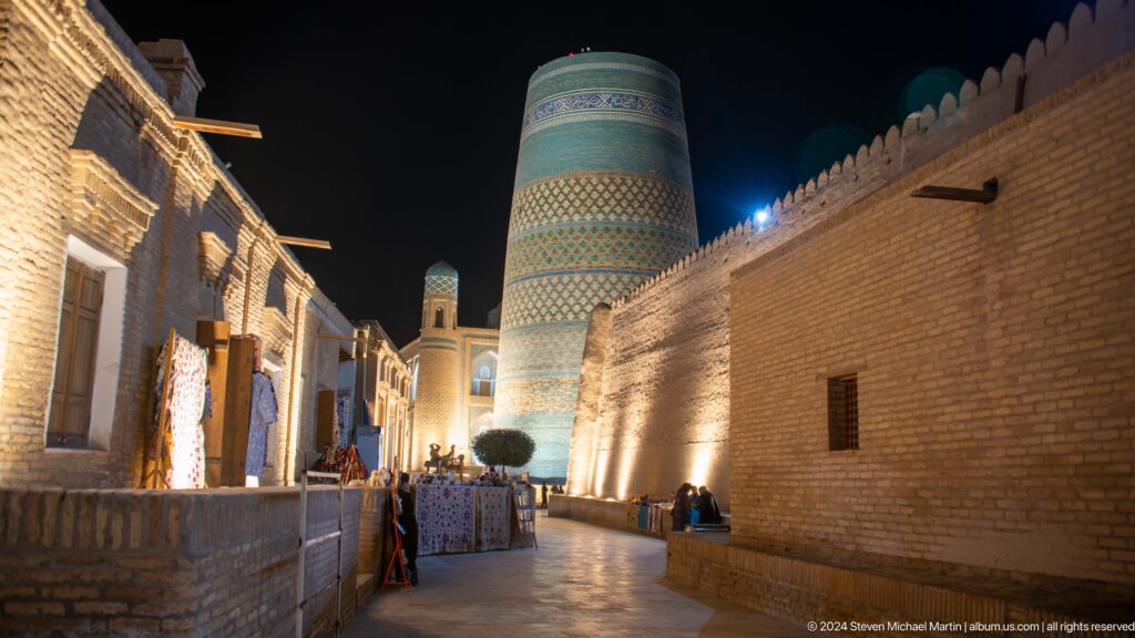Night street leading toward floodlit kalta minor.