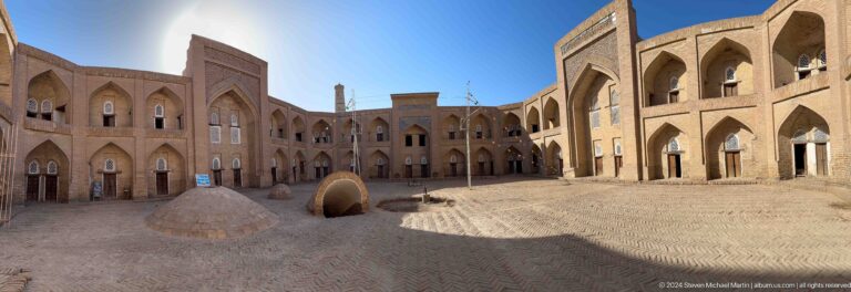 Wide madrasa courtyard with domed well or cistern.