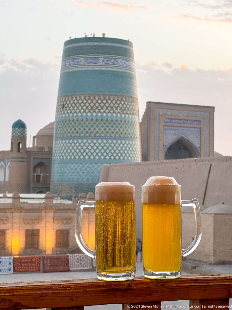 Two glasses of beer with kalta minor beyond.