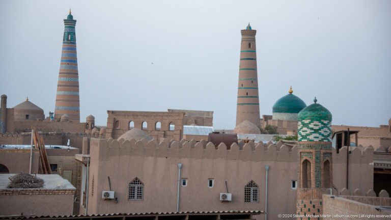 Skyline with islam khoja minaret, domes, and city walls.