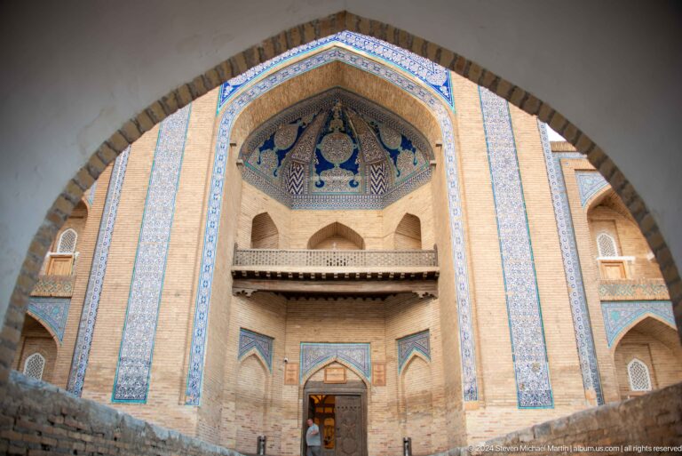 Ornate blue-tiled madrasa portal.