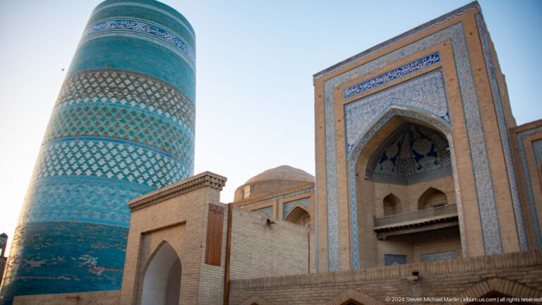 Kalta minor and monumental tiled portal.