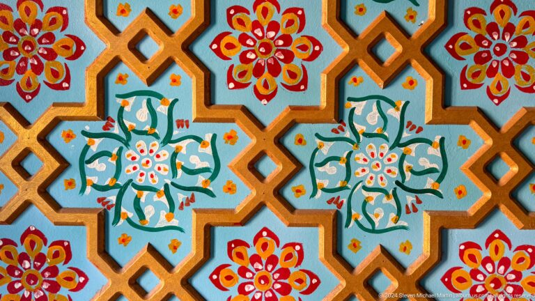 Colorful floral geometric tile pattern close-up.