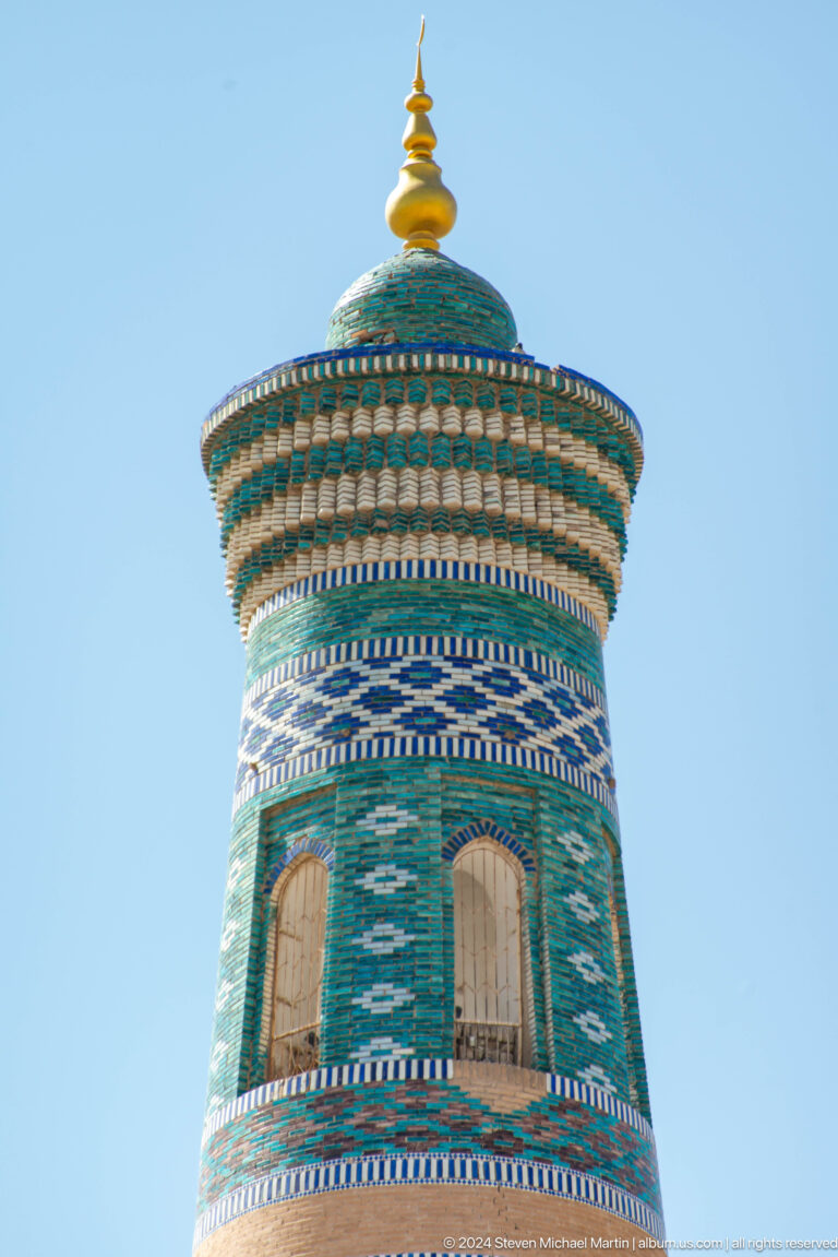 Turquoise and blue tiled minaret crown.
