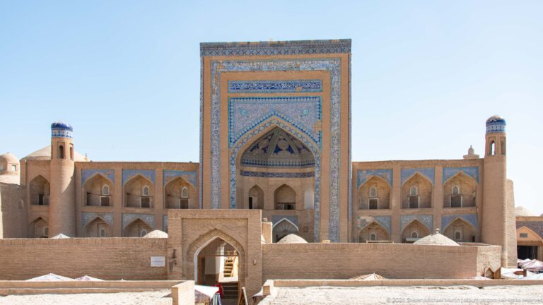 Monumental madrasa portal and courtyard facade.