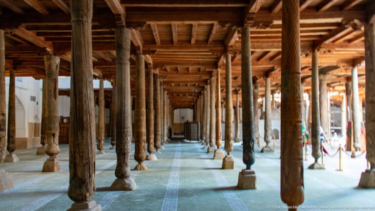 Long perspective through juma mosque wooden columns.