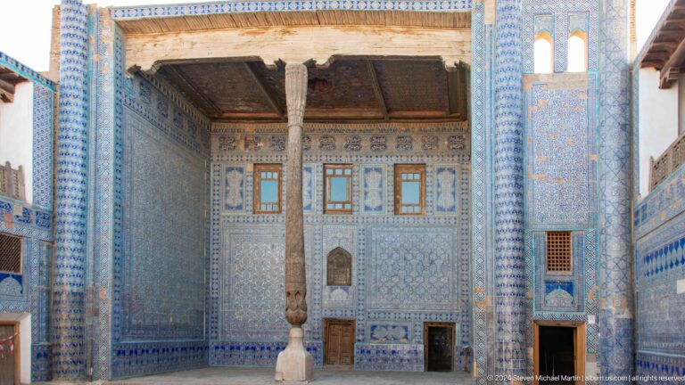 Ceremonial courtyard niche with carved column and tilework.