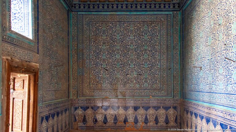 Large painted wall panel above tiled dado.