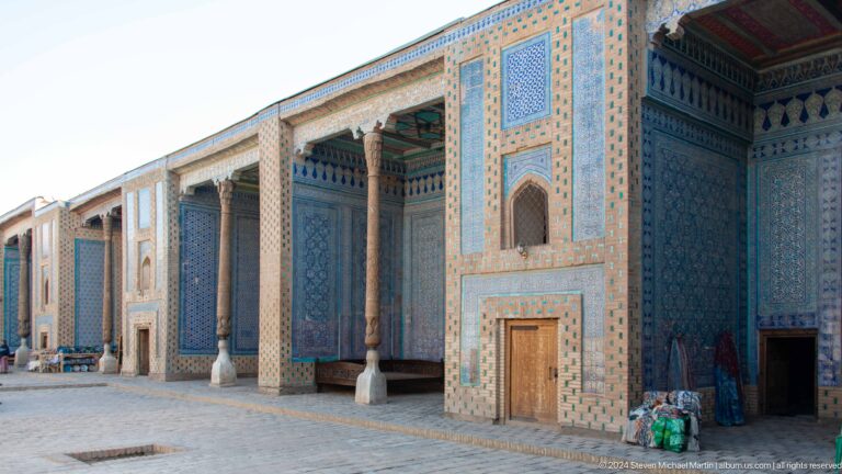 Colonnaded blue-tiled palace facade.