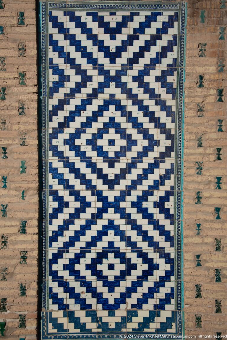 Bold blue-and-white diamond mosaic panel.