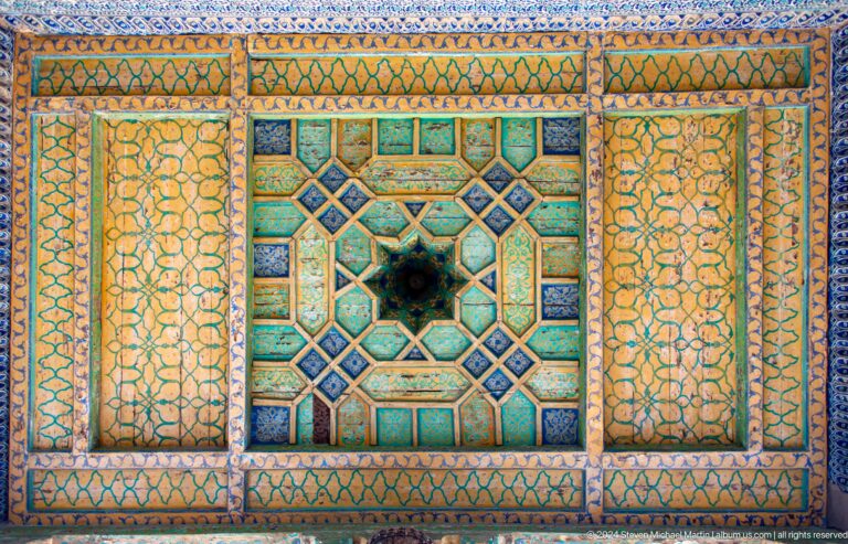 Gold and turquoise ceiling panel with star medallion.