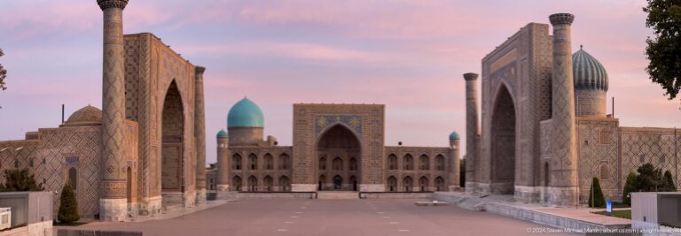 Wide centered view of Tilya-Kori Madrasa across the open Registan plaza.