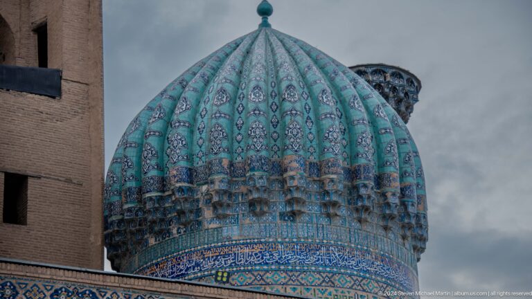 Close profile of the ribbed turquoise dome of Sher-Dor Madrasa.