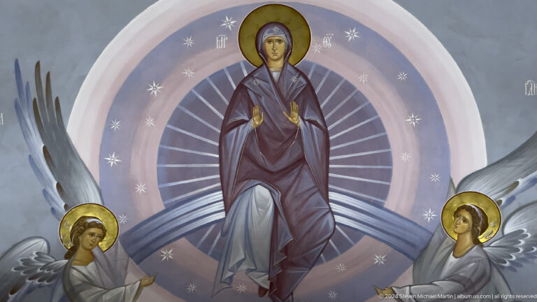 Mural of a haloed woman holding a cross within a circular field, with angels below.