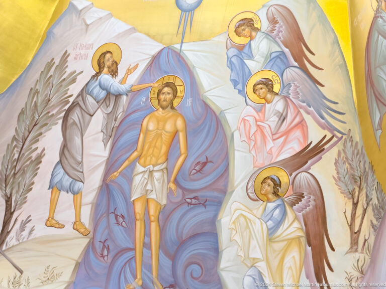 Close mural view of Christ being baptized by John the Baptist as angels watch.