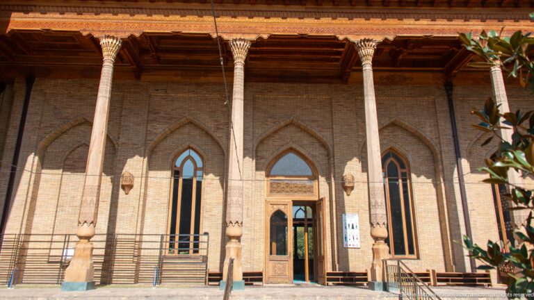 Wooden columns and deep eaves fronting pointed brick arches and doorways at the Khast Imom complex in Tashkent.