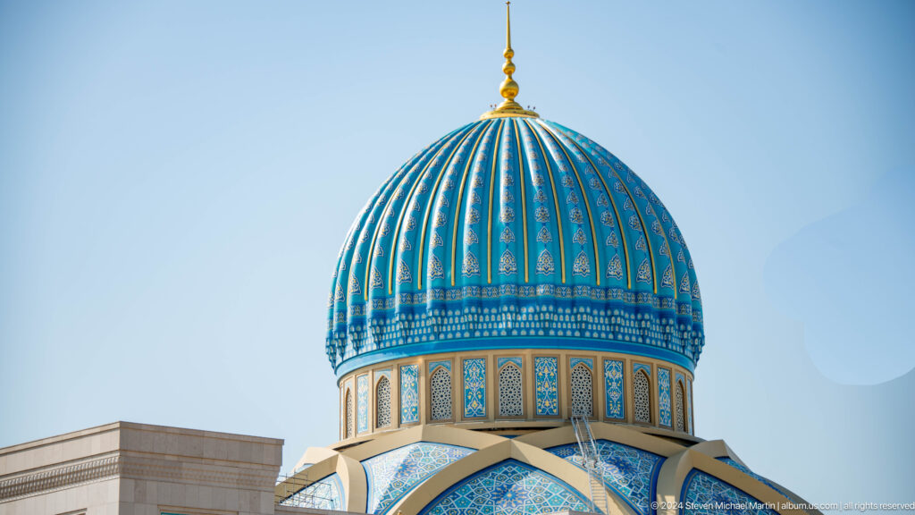 Large blue ribbed dome with patterned tile ribs and gold finial at the Khast Imom complex in Tashkent.