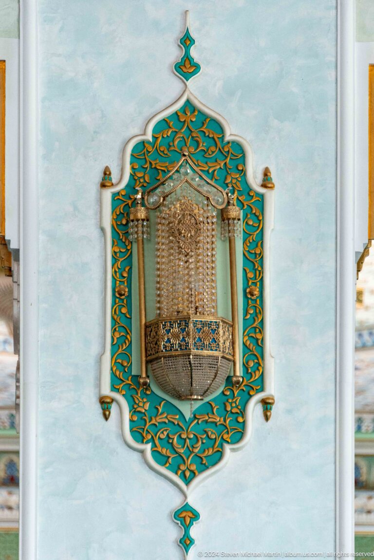 Tall turquoise-and-gold framed recess with a fine hanging or lattice element at the Khast Imom complex in Tashkent.