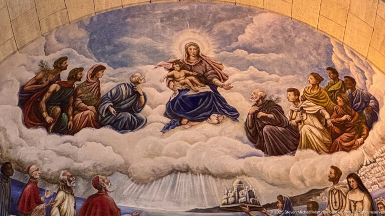 Close-up of the apse mural at Notre-Dame d’Afrique showing the Virgin and Child surrounded by groups of religious figures.