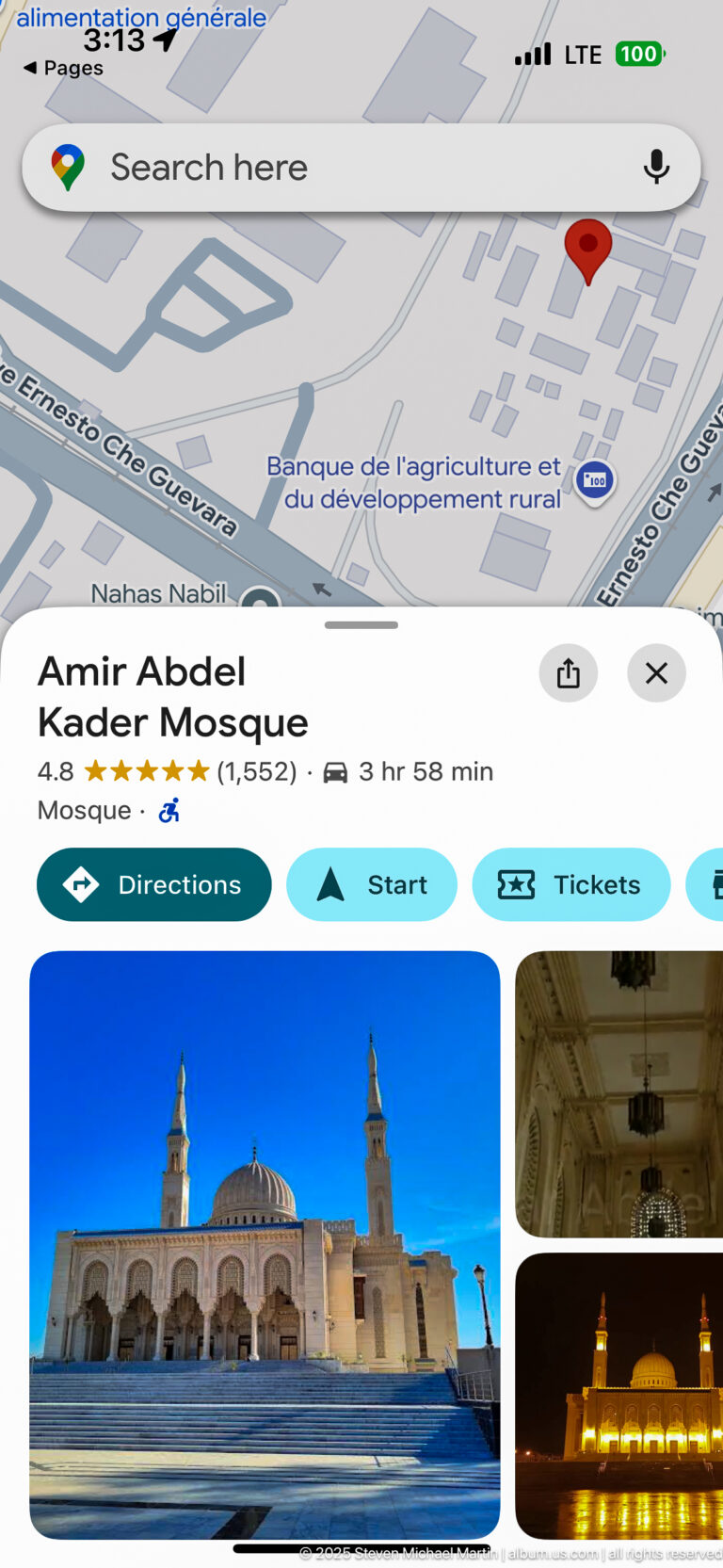 Smartphone screen showing a map listing and thumbnail photographs for Amir Abdel Kader Mosque in Constantine.