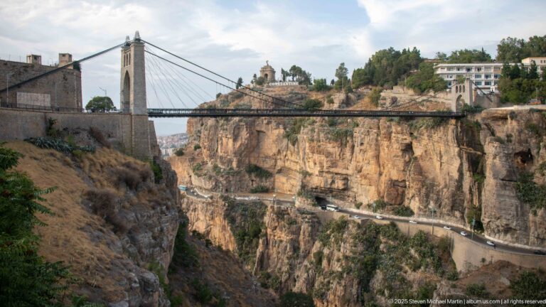 Sidi M’Cid Bridge spanning Constantine’s rocky gorge, with Monument aux Morts on the distant hill.