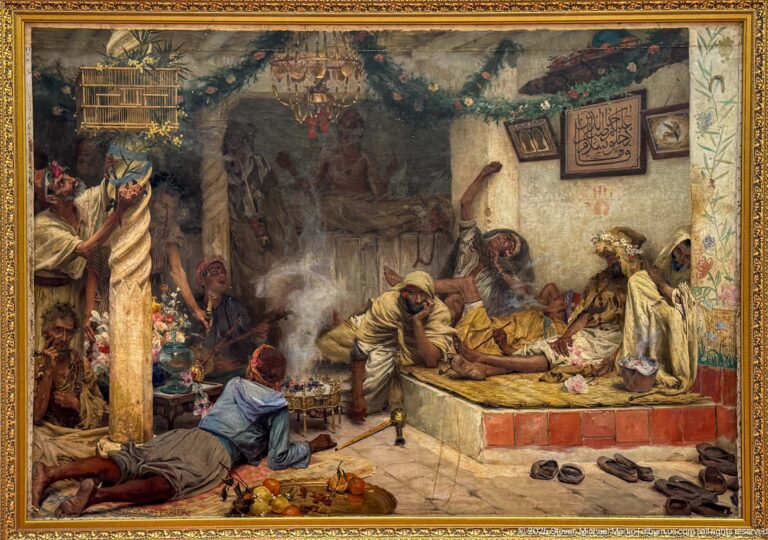Framed painting of a richly furnished North African interior with seated figures, textiles, vessels, fruit, and smoke.