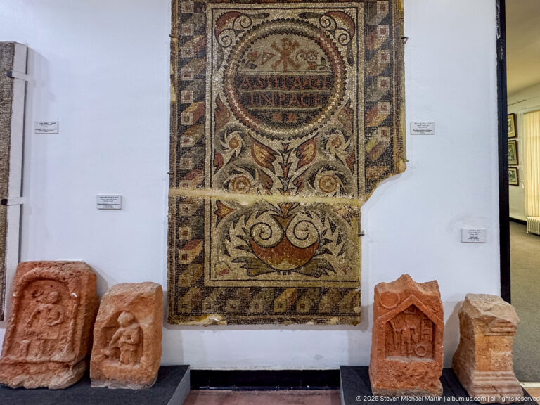 Fourth- to fifth-century funerary mosaic of Asella with a Chi-Rho, Latin epitaph, wreath, vase, and stylized plant.