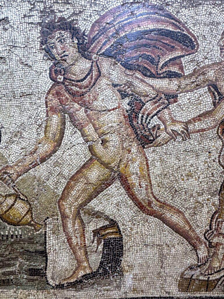 Close detail of Hylas striding in the Roman mosaic of his abduction by the nymphs.