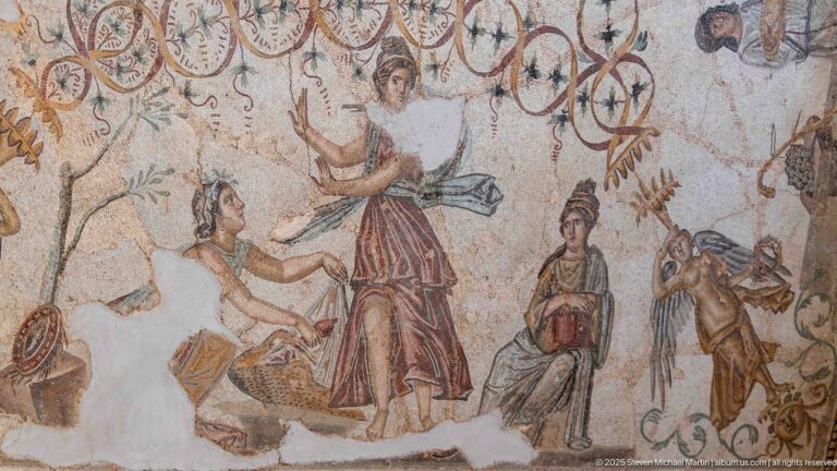 Figurative detail from the Djemila Bacchus Mosaic with several draped figures beneath looping ornamental motifs.