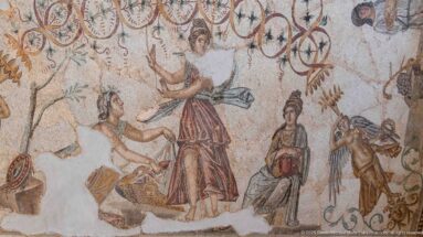 Figurative detail from the Djemila Bacchus Mosaic with several draped figures beneath looping ornamental motifs.