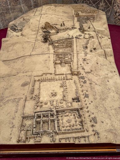 Raised museum model of Djemila showing streets, building foundations, terraces, and larger Roman architectural complexes.