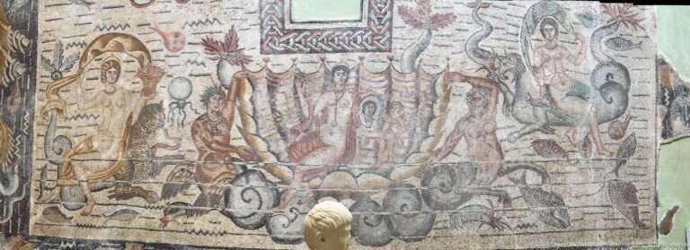 Central detail of the Toilet of Venus Mosaic showing Venus in a shell with a mirror and surrounding marine figures.