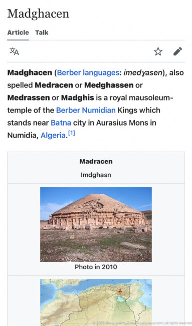 Mobile reference page for Madghacen with introductory text, a small mausoleum photograph, and a map locating the site in Algeria.