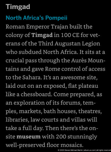 Interpretive panel with white text on a black background introducing the Roman city of Timgad.