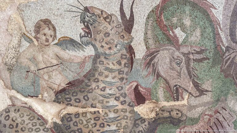 Roman mosaic detail with a winged youth, spotted big cat, horned animal, and surrounding foliage.