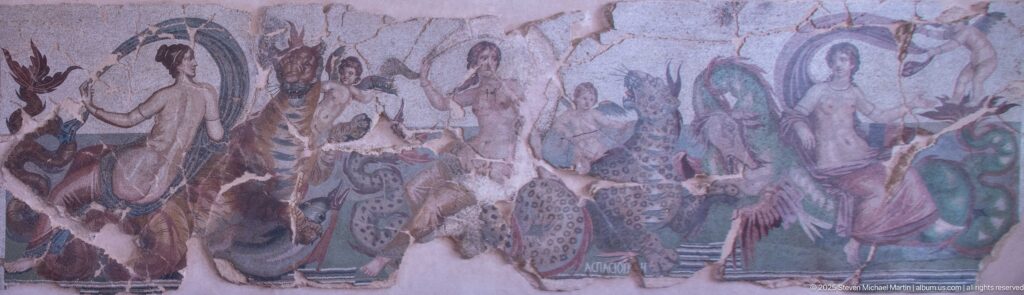Wide view of the Mosaic of the Nereids by Aspasios with three Nereids, Cupids, and fantastical marine monsters.