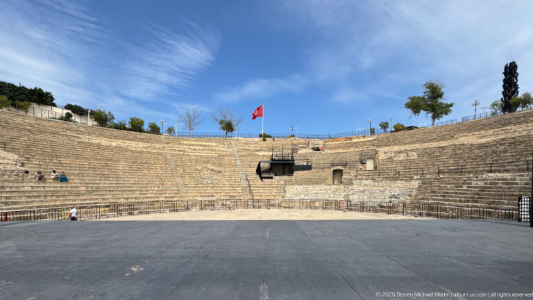 View from the performance area toward the broad semicircular stone seating of the Roman Theatre of Carthage.