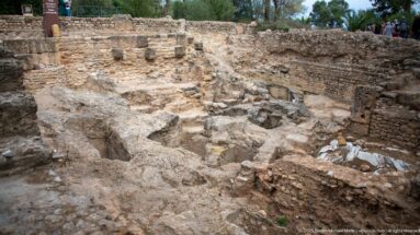 Excavated rock-cut burial pits and low masonry in the archaic Phoenician necropolis at Carthage.