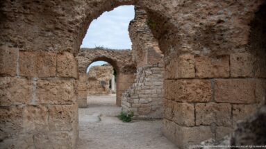 View through a large Roman arch toward successive smaller arches in the substructures of the Baths of Antoninus.
