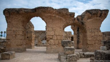 Two large adjoining Roman arches supported by massive masonry piers in the Baths of Antoninus.