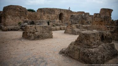 Massive squared stone bases and low piers arranged across an open area of the Baths of Antoninus.
