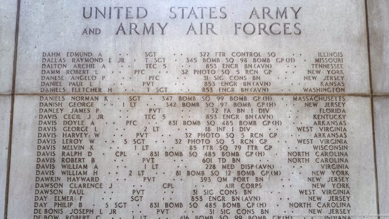 Close-up of engraved U.S. Army and Army Air Forces names, ranks, units, and states on a memorial panel.