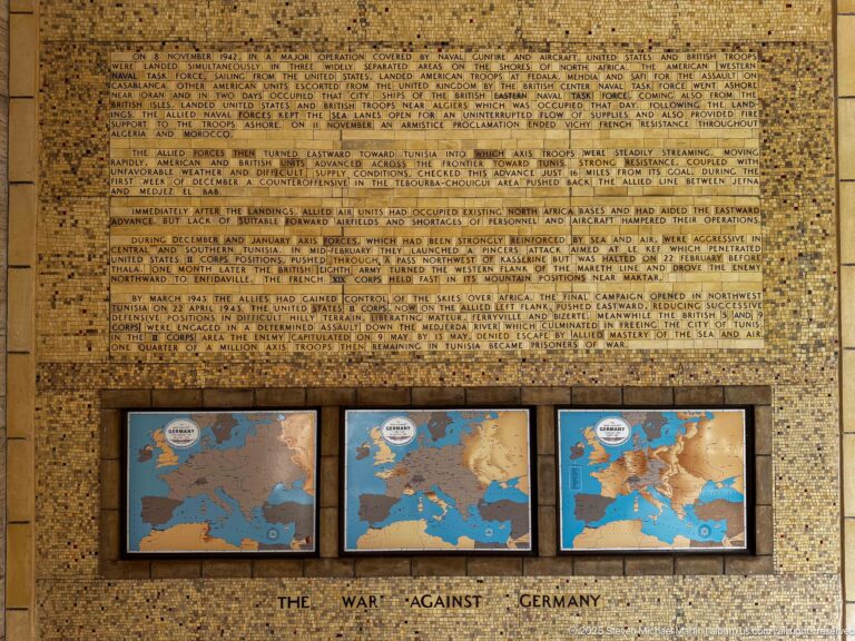 Three framed European war maps beneath a large historical panel labeled The War Against Germany.