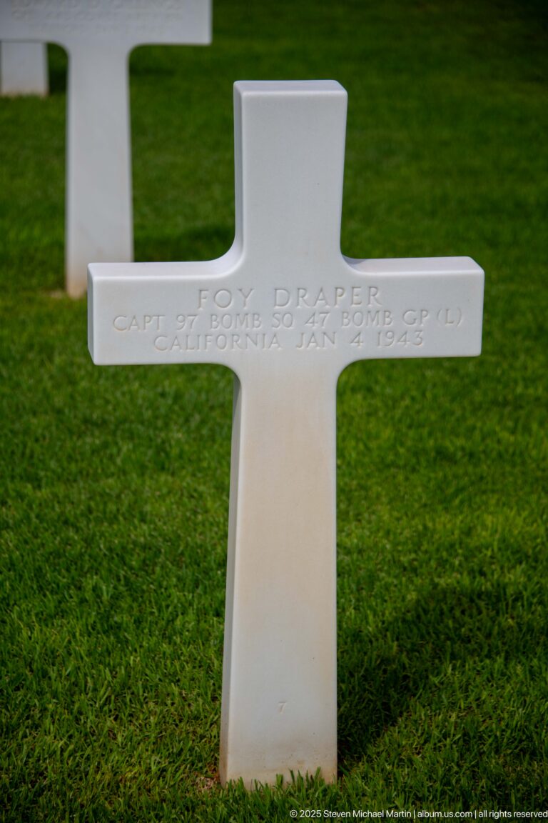 White Latin-cross grave marker for Captain Tom Draper of the U.S. Army Air Forces.